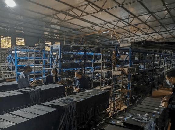 A modern mining farm showcasing rows of mining rigs